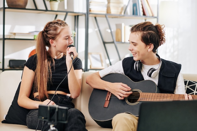 Voice training session showing proper breathing and posture methods for singing improvement